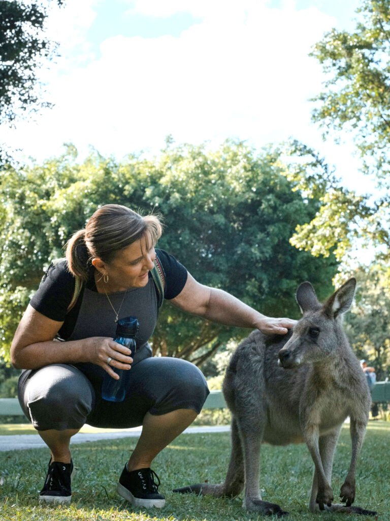 woman-petting-kangaroo-australiazoo-sunshinecoast